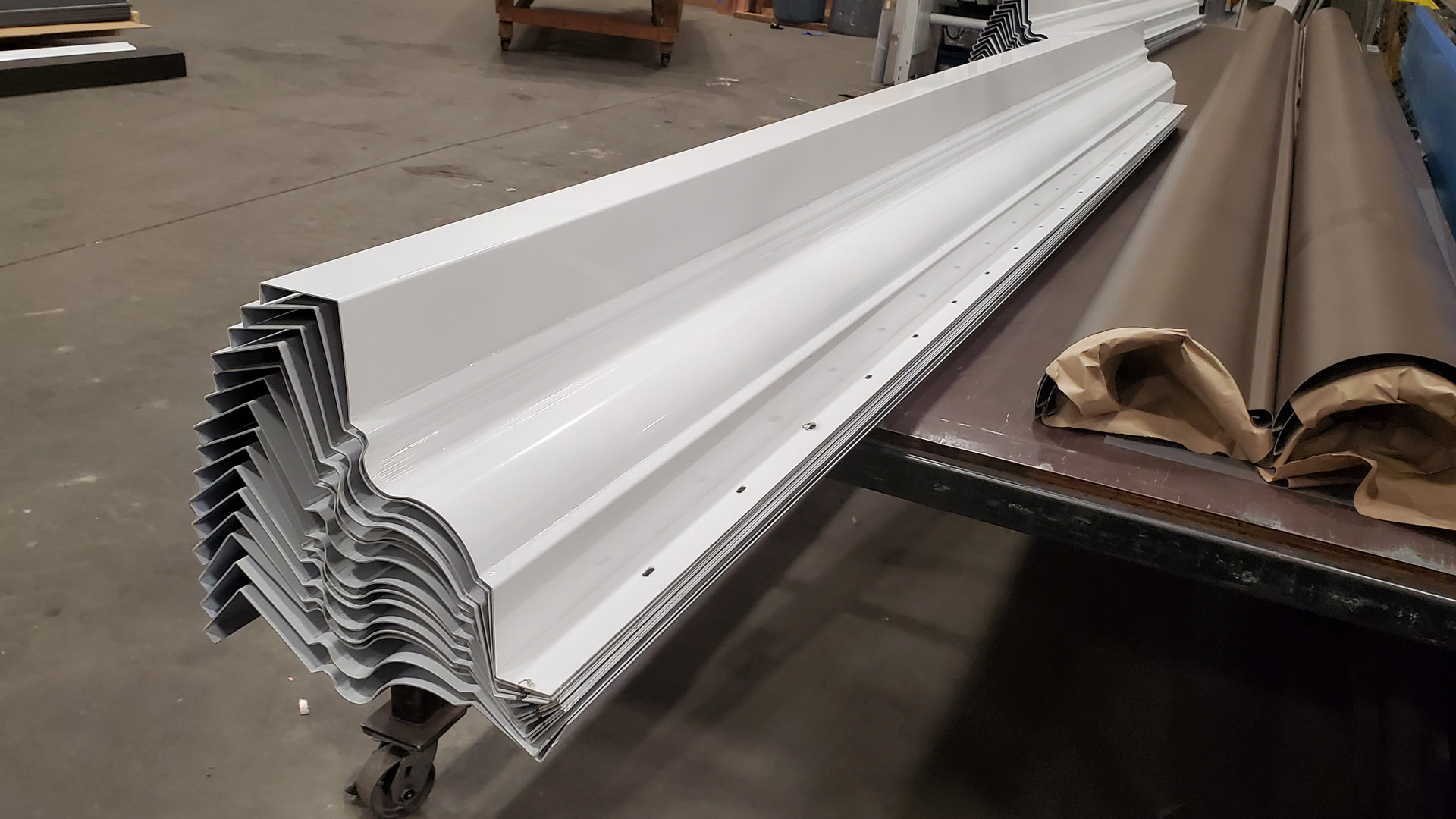 White Kynar aluminum custom cornice with slots for screws