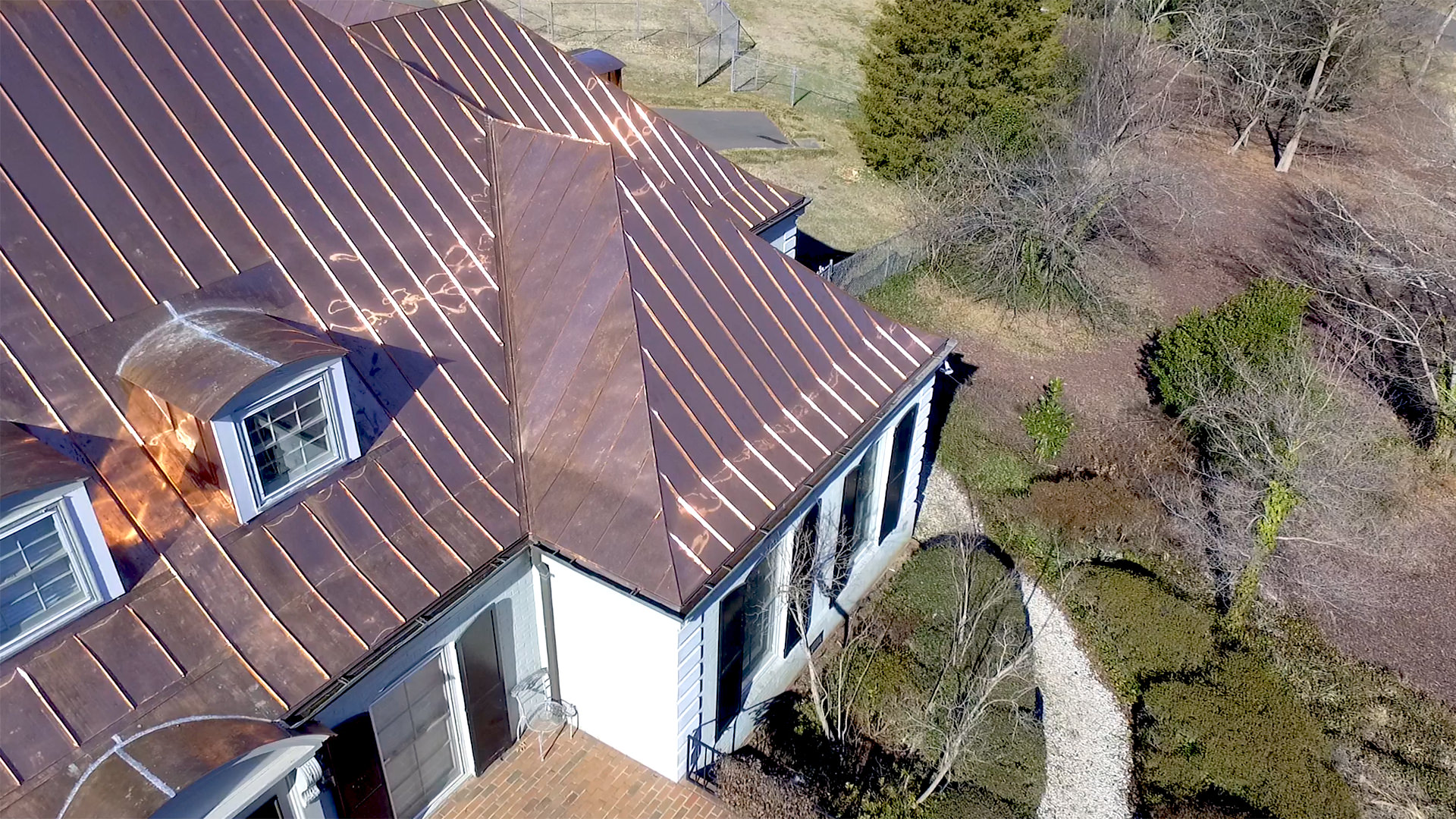 Double lock standing seam copper roof panels and gutters