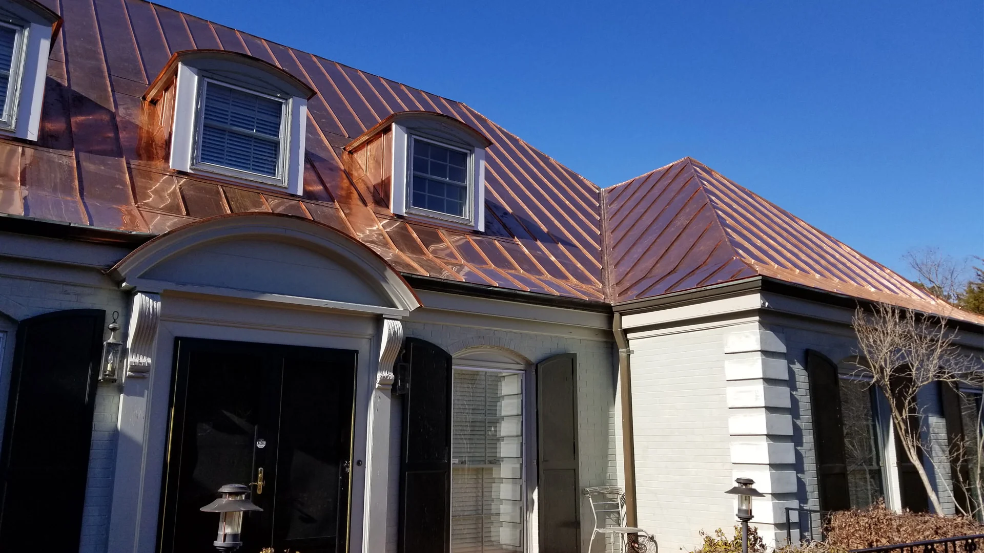 Double lock standing seam copper roof panels and gutters