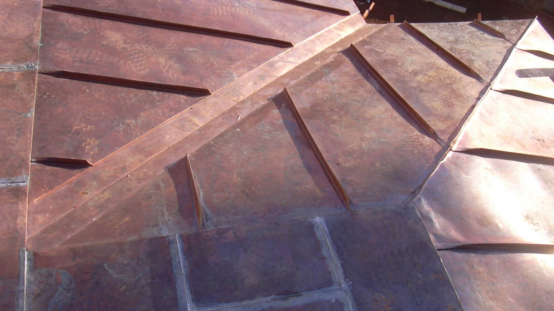 Flat locked and standing seam copper panels
